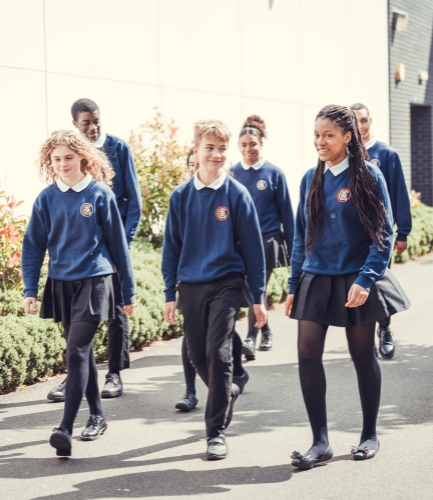 Group of students walking and talking.